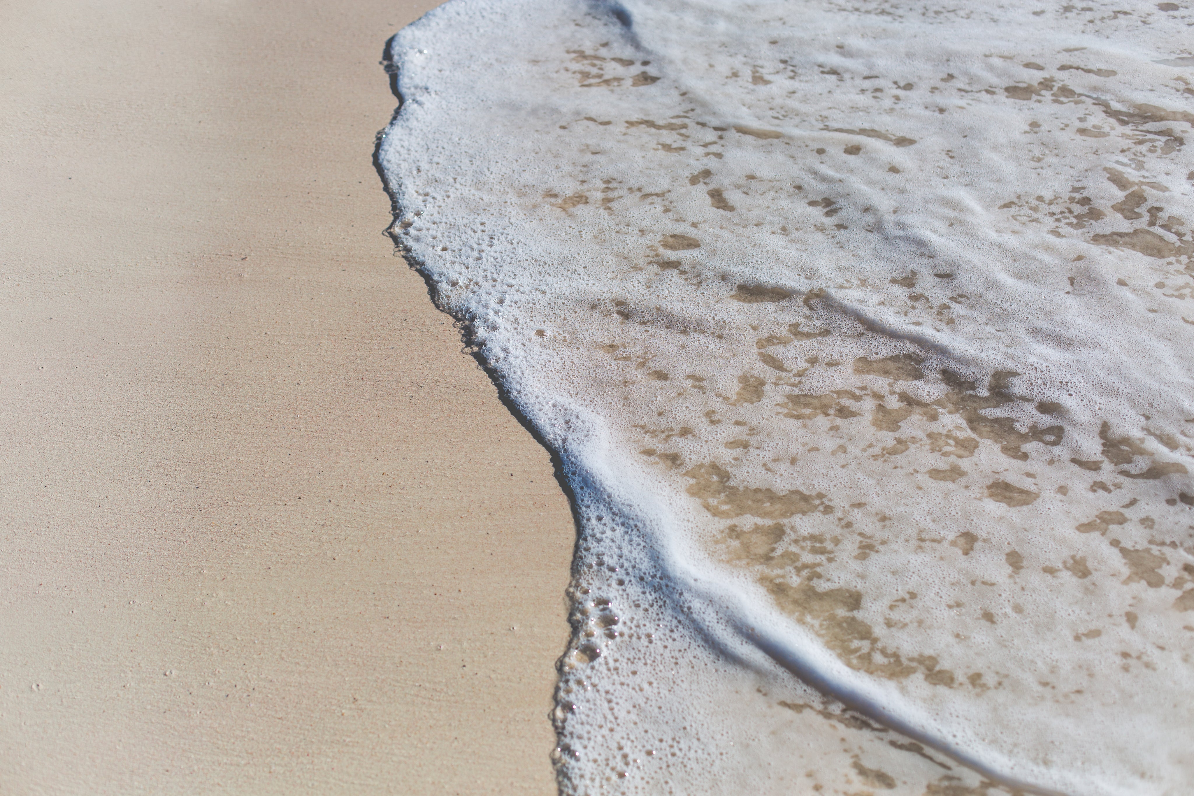 ocean-water-on-beach-sand.jpg